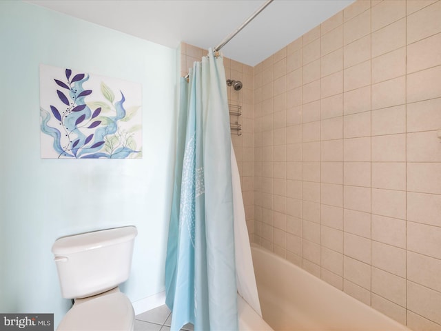 bathroom with toilet and shower / tub combo with curtain