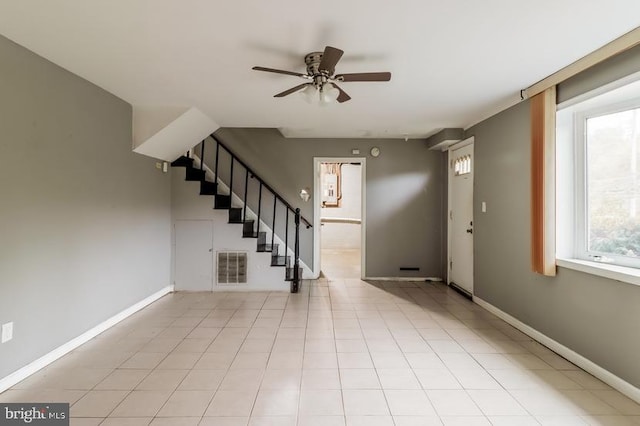 tiled foyer entrance with ceiling fan