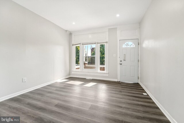 entryway with dark hardwood / wood-style floors