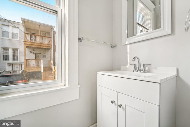 bathroom featuring a wealth of natural light and vanity