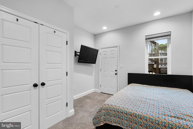 carpeted bedroom featuring a closet