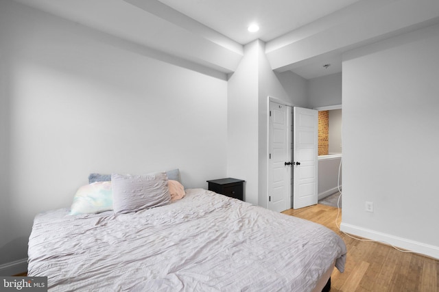 bedroom with light hardwood / wood-style floors