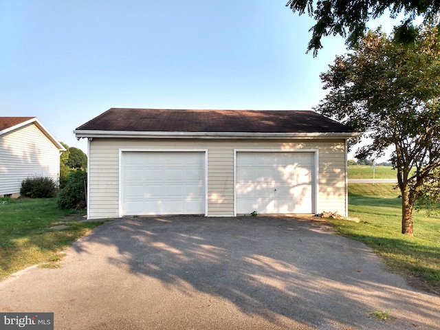 garage with a lawn