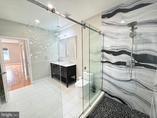 bathroom featuring tile patterned flooring, toilet, visible vents, a marble finish shower, and double vanity