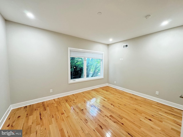 spare room with light wood-type flooring