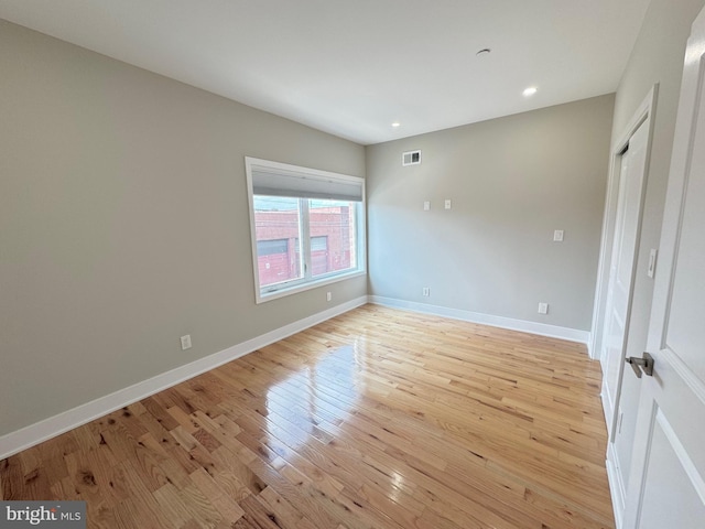 empty room with light wood-type flooring