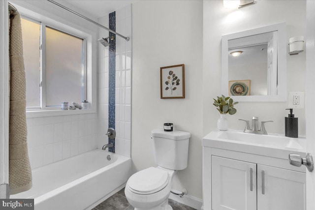 full bathroom featuring vanity, toilet, and tiled shower / bath combo