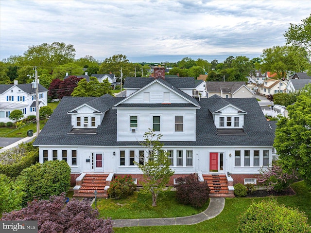 view of front facade featuring a front yard and french doors