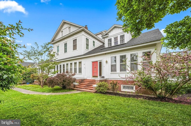 view of front of property with a front lawn