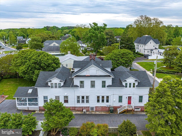 birds eye view of property with a residential view