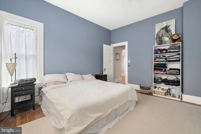 bedroom featuring a closet and wood finished floors