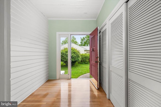 doorway with light wood-type flooring