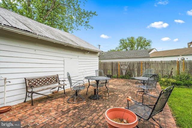 view of patio / terrace featuring fence