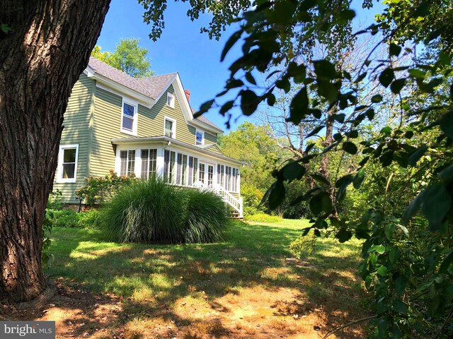 view of home's exterior featuring a lawn