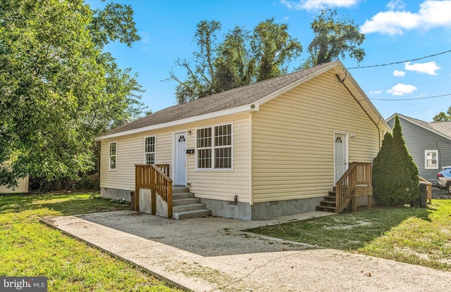 view of front of house with crawl space and a front yard