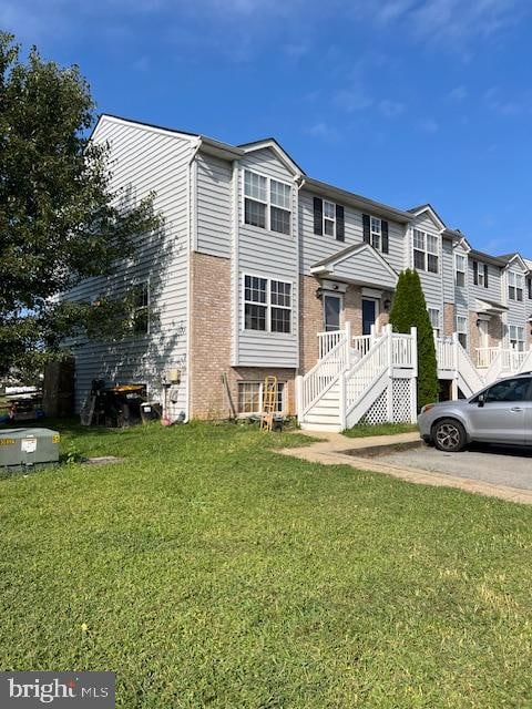 view of property with a front lawn