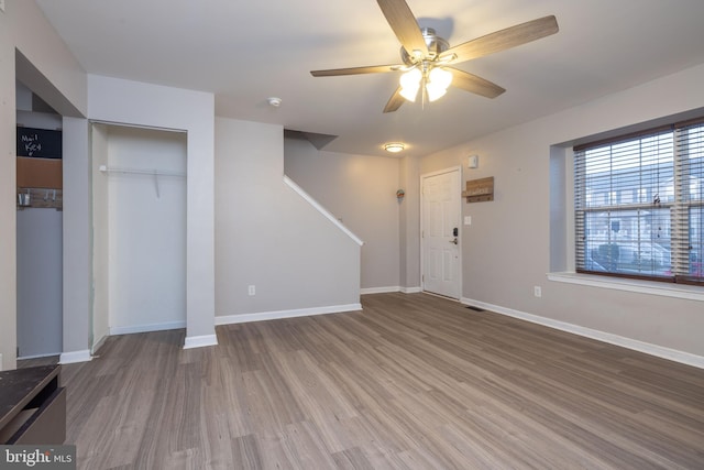 interior space featuring ceiling fan and wood-type flooring