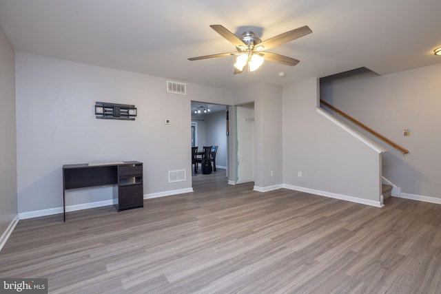 interior space featuring light wood-type flooring and ceiling fan