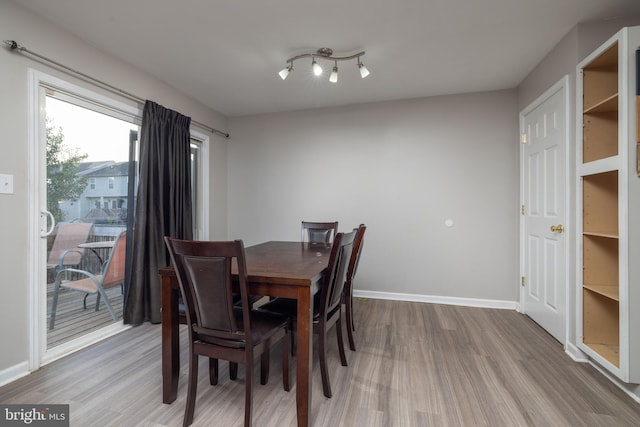 dining room with hardwood / wood-style flooring