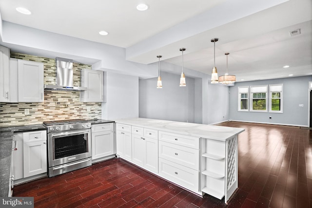 kitchen with dark hardwood / wood-style flooring, kitchen peninsula, stainless steel stove, decorative backsplash, and wall chimney exhaust hood