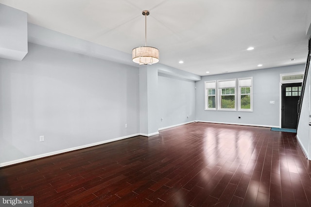 unfurnished room featuring dark wood-type flooring