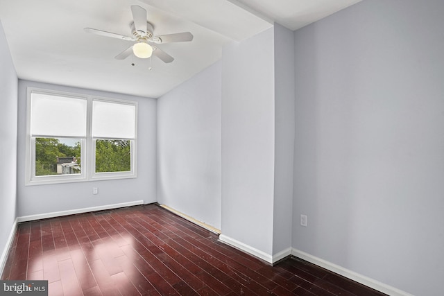 empty room featuring ceiling fan and dark hardwood / wood-style floors