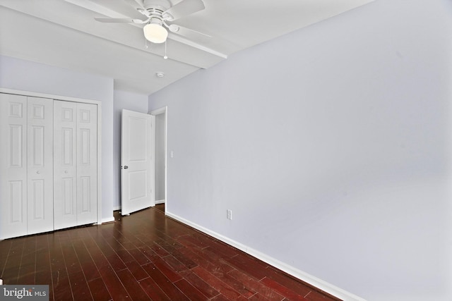 unfurnished bedroom featuring a closet, ceiling fan, and dark hardwood / wood-style floors