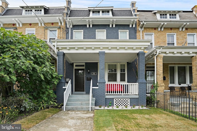 view of property with a porch