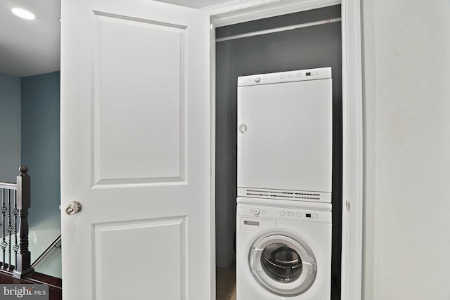 laundry area with stacked washer and dryer