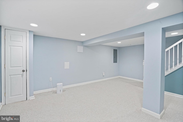 basement featuring electric panel and carpet floors