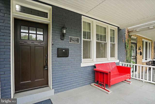 doorway to property featuring a porch