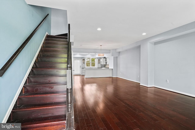 stairway featuring hardwood / wood-style floors