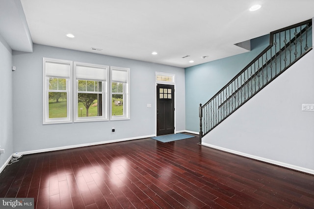 entrance foyer featuring dark hardwood / wood-style floors