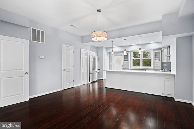 unfurnished living room with dark hardwood / wood-style floors