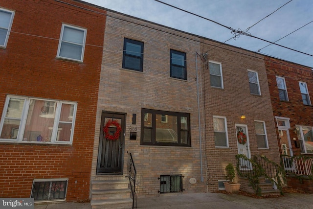 view of front of property featuring brick siding