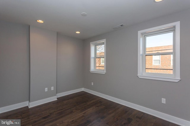 empty room featuring dark hardwood / wood-style floors