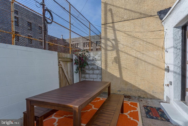 view of patio / terrace featuring fence