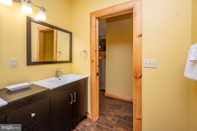 bathroom with baseboards and vanity