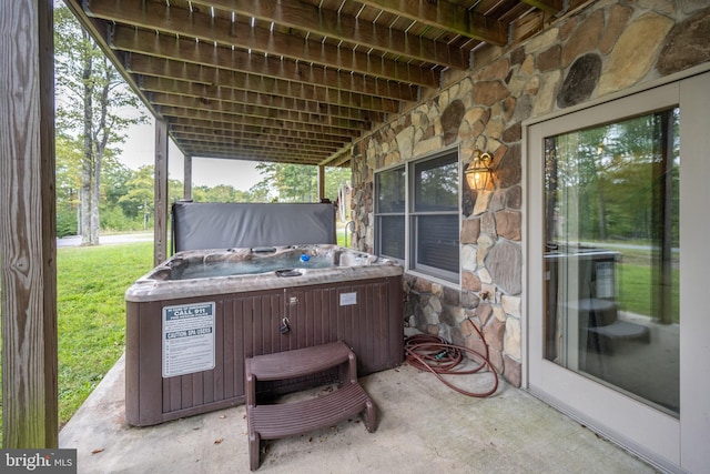 view of patio with a hot tub