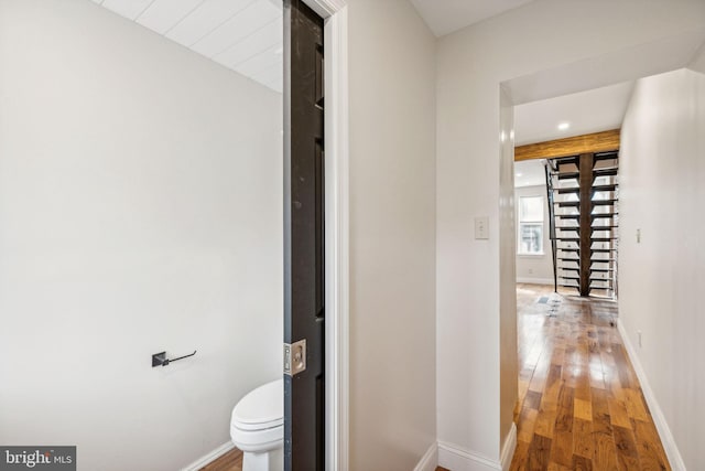 corridor with wood-type flooring