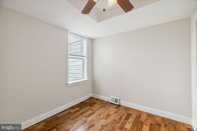 unfurnished room with ceiling fan and hardwood / wood-style flooring