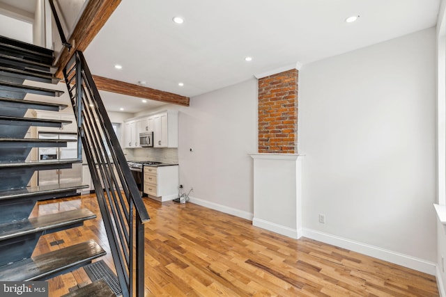 stairway featuring hardwood / wood-style floors