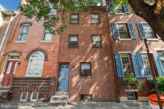 multi unit property featuring brick siding