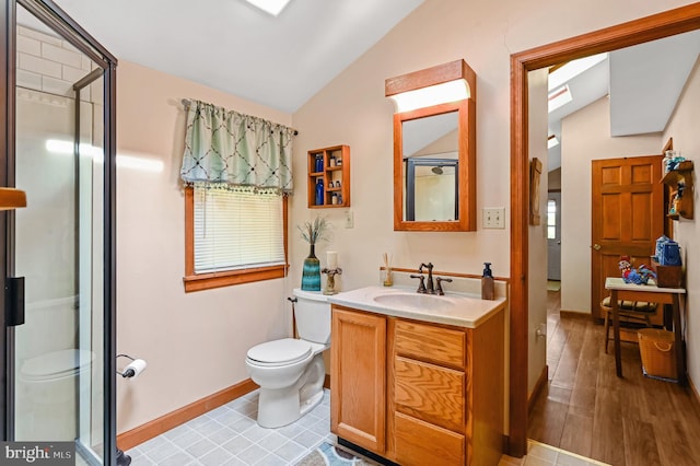 bathroom featuring hardwood / wood-style flooring, a shower with door, vaulted ceiling, toilet, and vanity