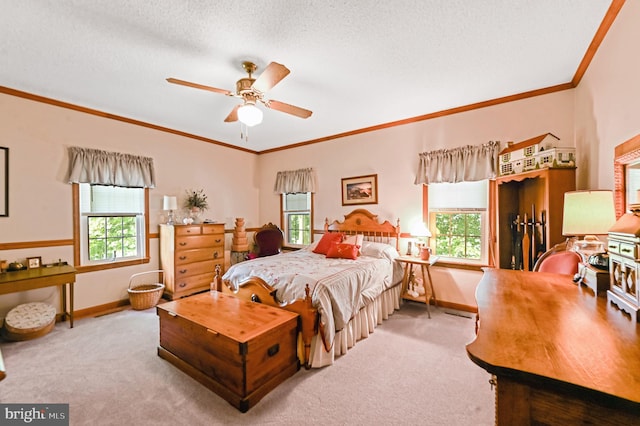 carpeted bedroom featuring ceiling fan and a textured ceiling