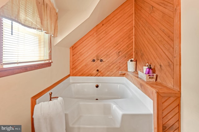 bathroom featuring a tub to relax in