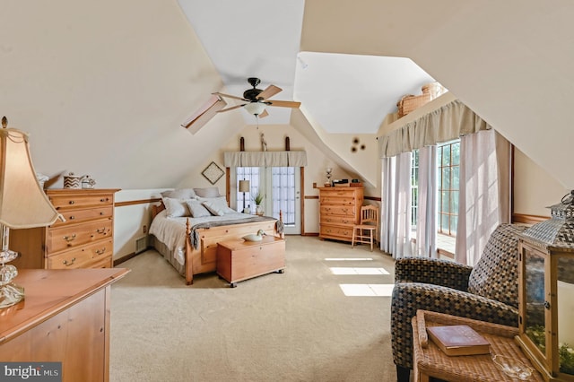 bedroom featuring light colored carpet, vaulted ceiling, and ceiling fan