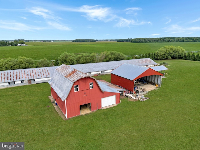 birds eye view of property with a rural view