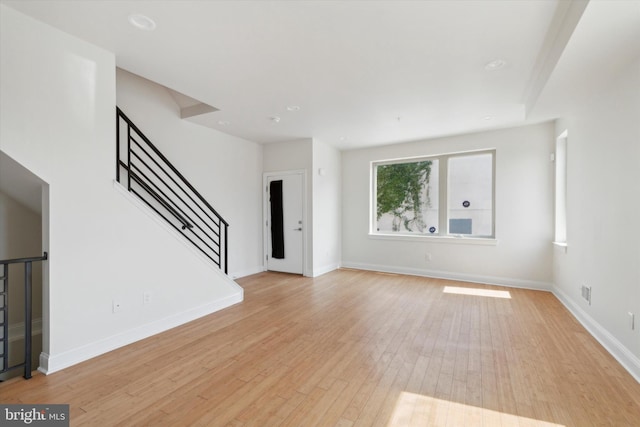 unfurnished living room featuring light hardwood / wood-style flooring