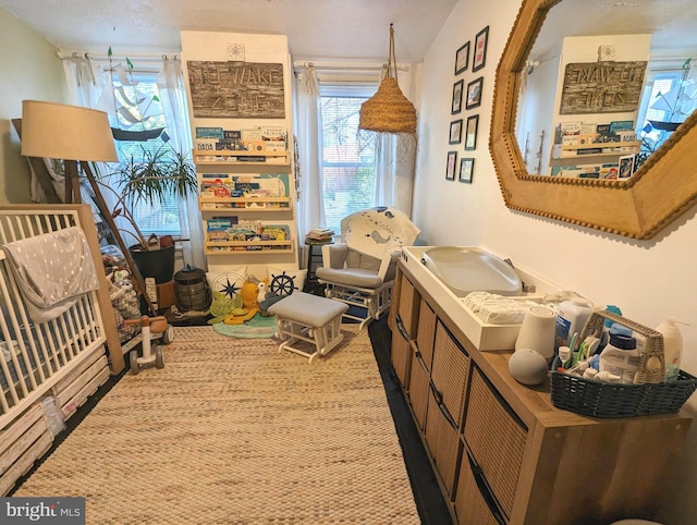 interior space with a textured ceiling